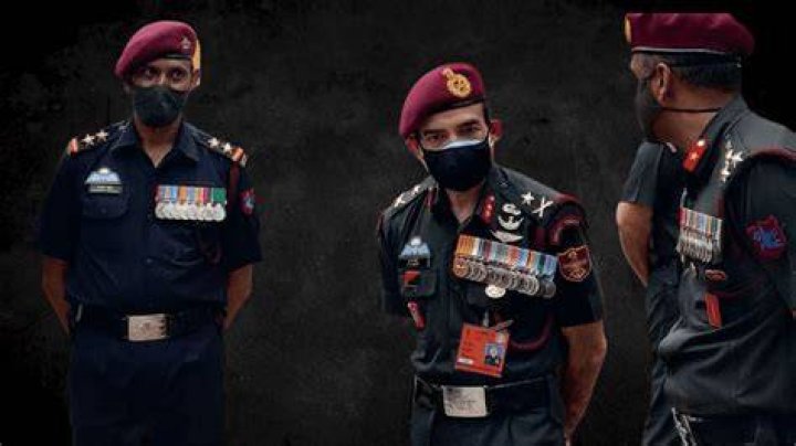 Army Officers With A Danger Unexploded Bomb Sign