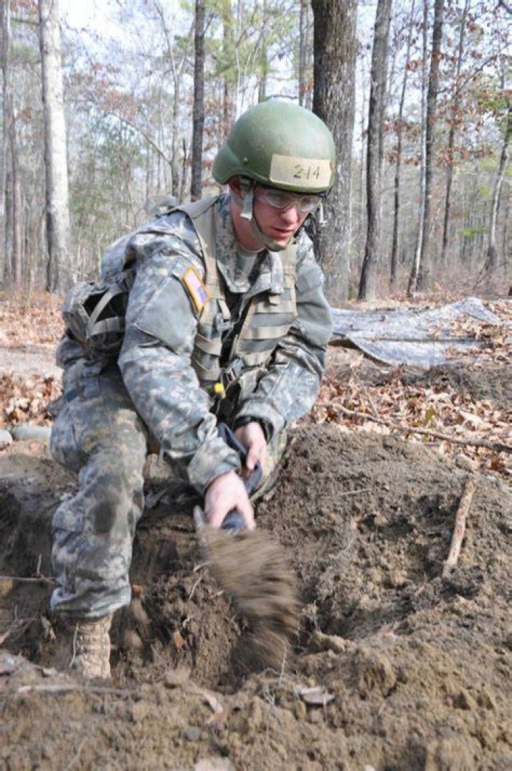 Army Sergeant Digging For A Shell In Los Angeles