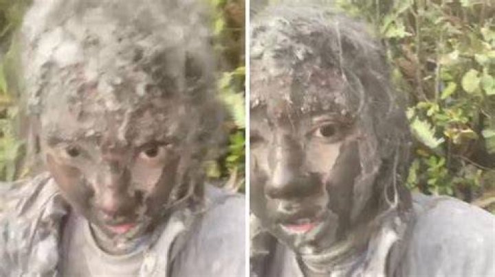 Ash Covered Woman Covers Her Face