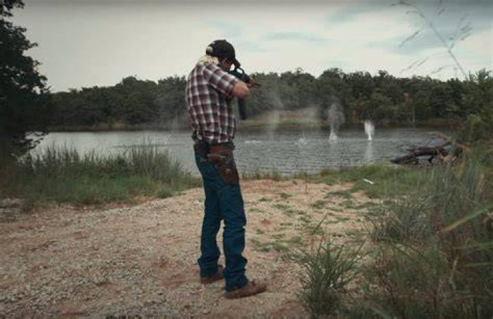Joe Exotic Shooting A Machine Gun