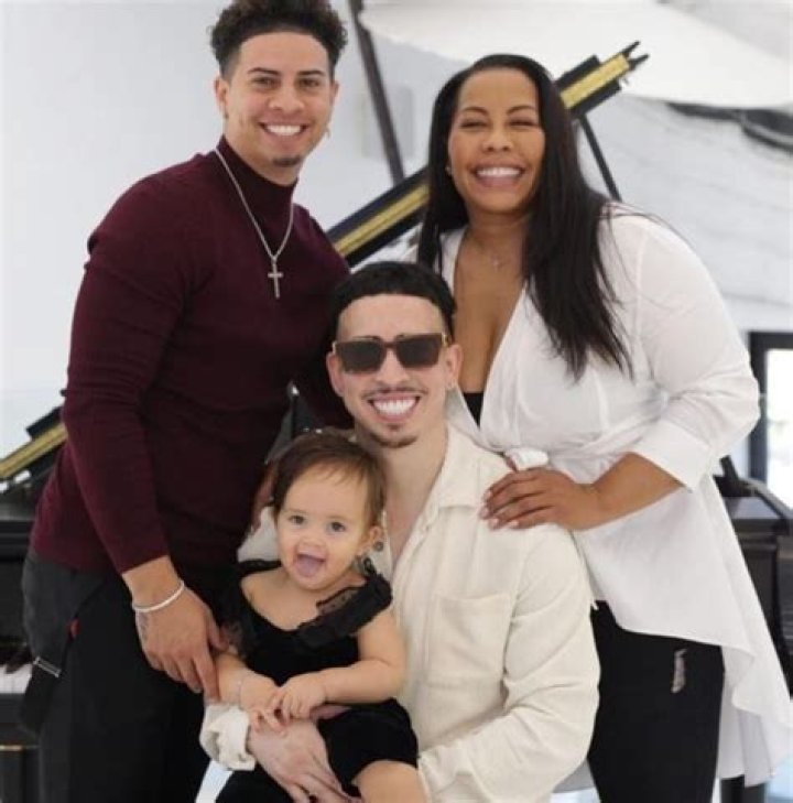 Landon with his mother Michole McBroom, brother Austin McBroom, and daughter