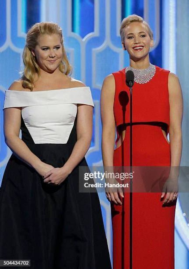 Presenters Amy Schumer and Jennifer Lawrence speak onstage during the 73rd Annual Golden Globe Awards at The Beverly Hilton Hotel on January 10, 2016