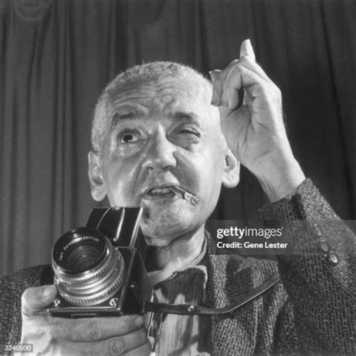 Weegee Holding Camera